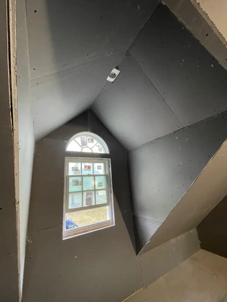 Dormer with arched window, drywall hung