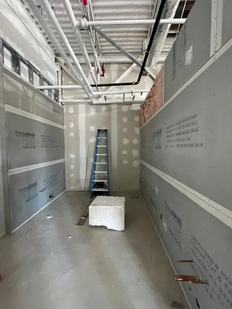 Commercial corridor with cement board installed